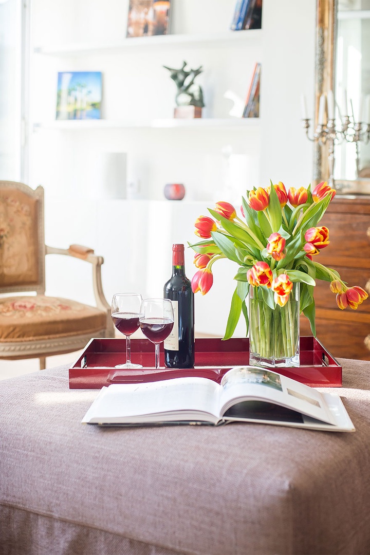 The ottoman doubles as a table and converts into a fold-away bed.