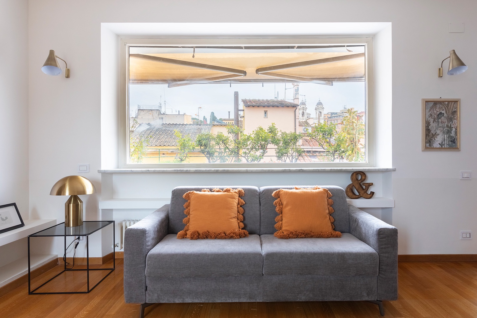 Large window brings iconic Roman views into the living room.