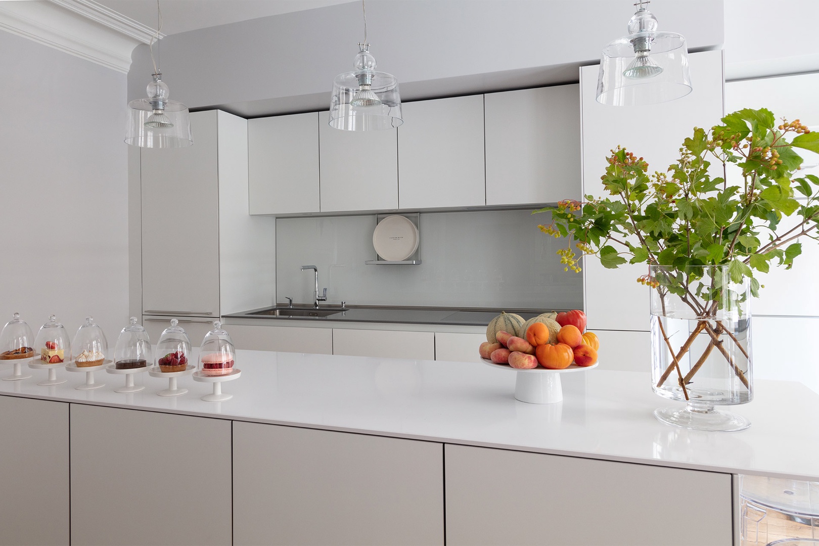 The sleek and modern kitchen is fully equipped with everything you need.