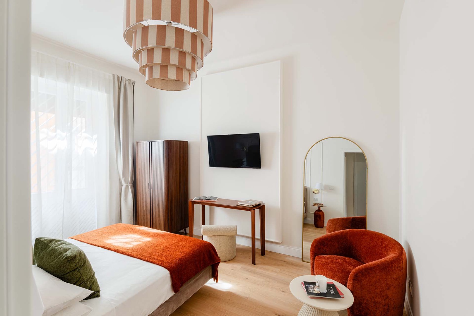 Wall-mounted TV in bedroom 1.