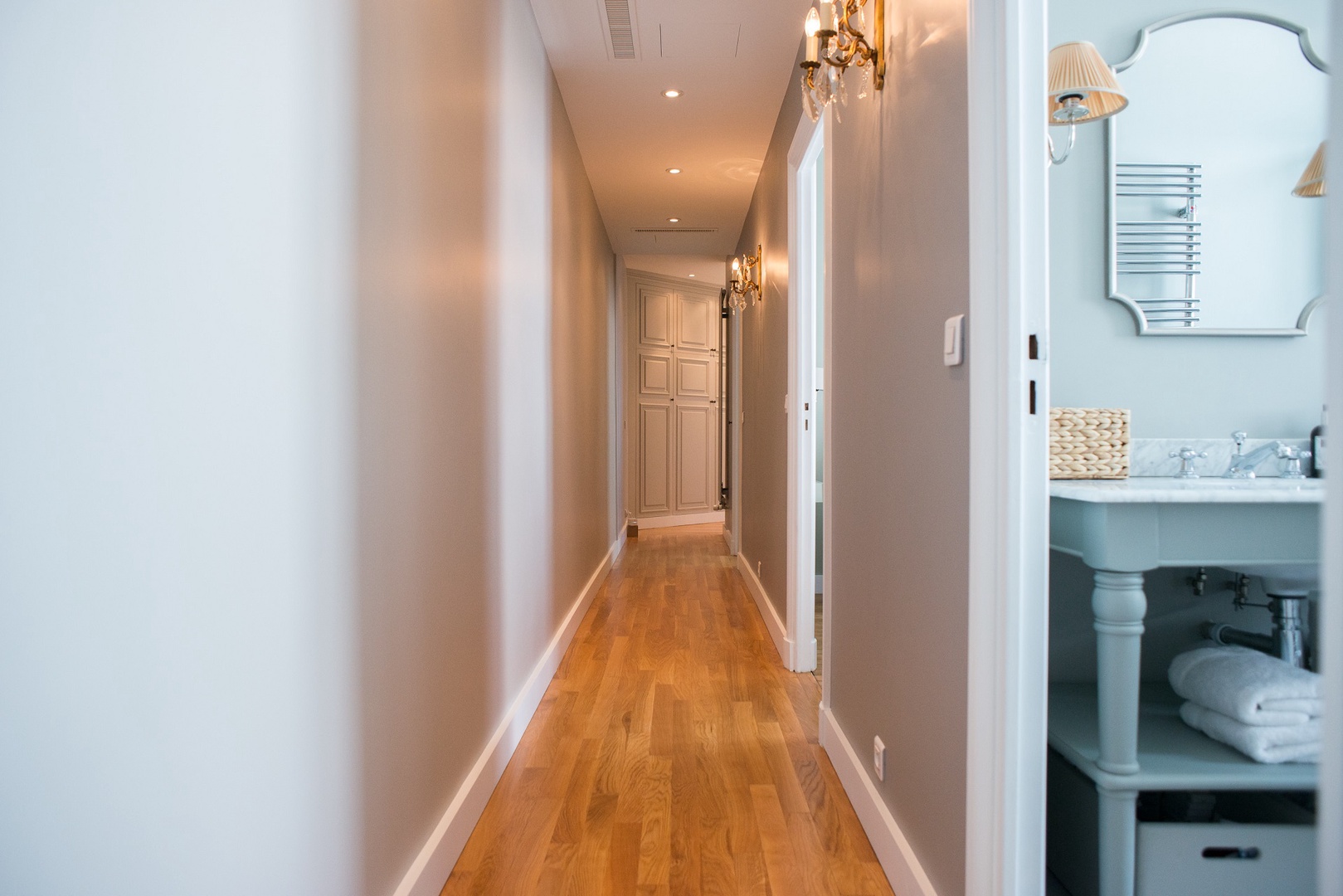 Long hallway with original oak flooring