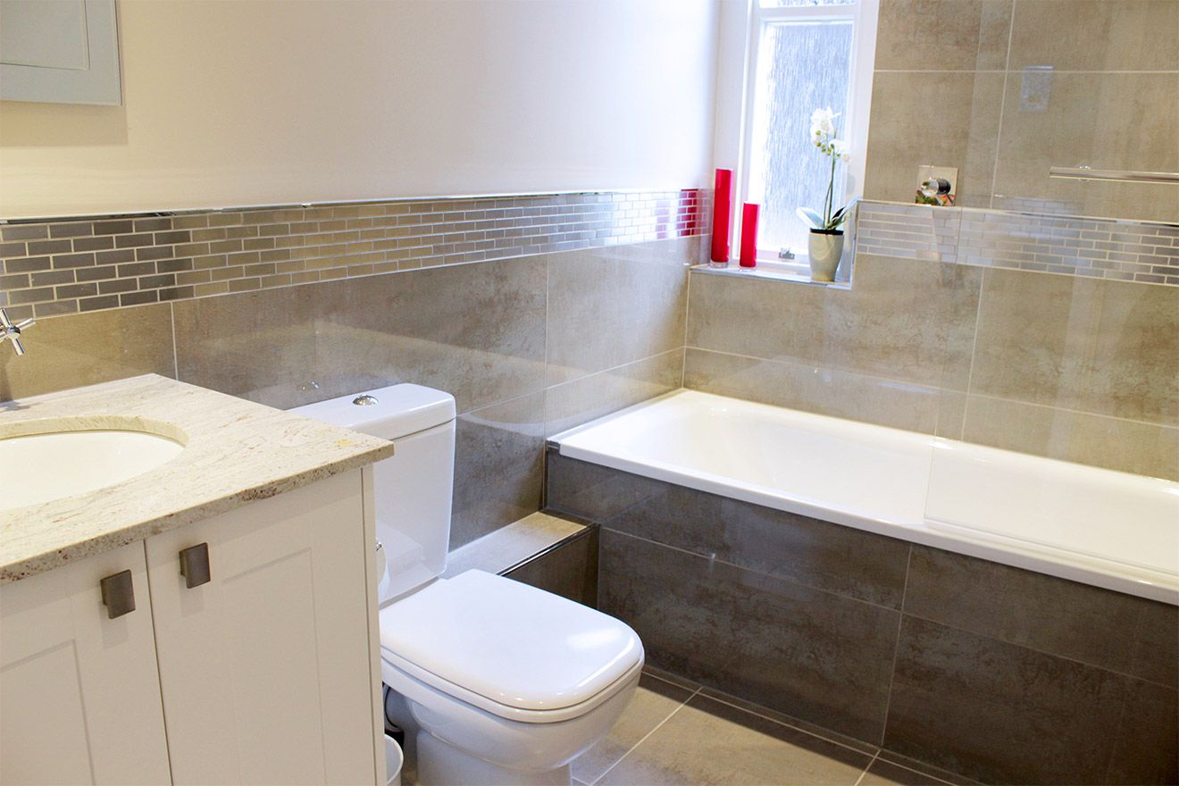 Bathroom with bathtub & shower combo, toilet and sink