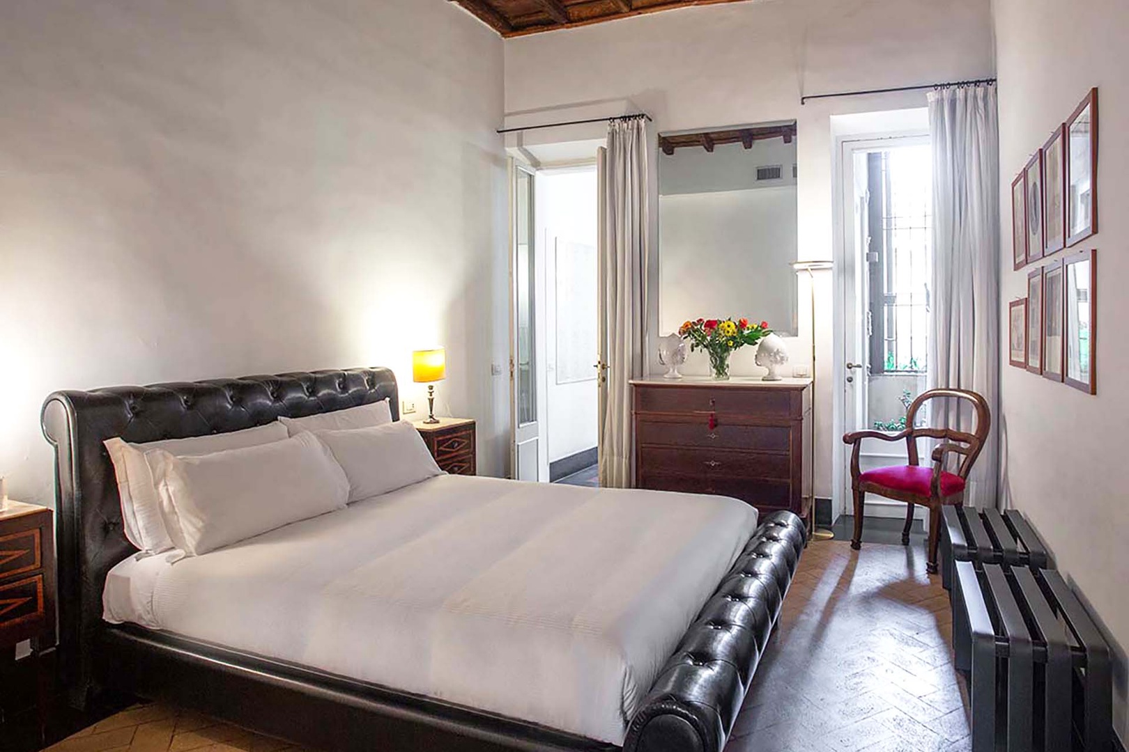 Sink into this luxurious leather bed surrounded by charming European architecture. Fresh flowers and classic furnishings create your perfect romantic retreat.