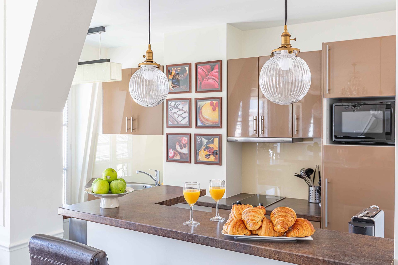 The kitchen is spacious and sunny.
