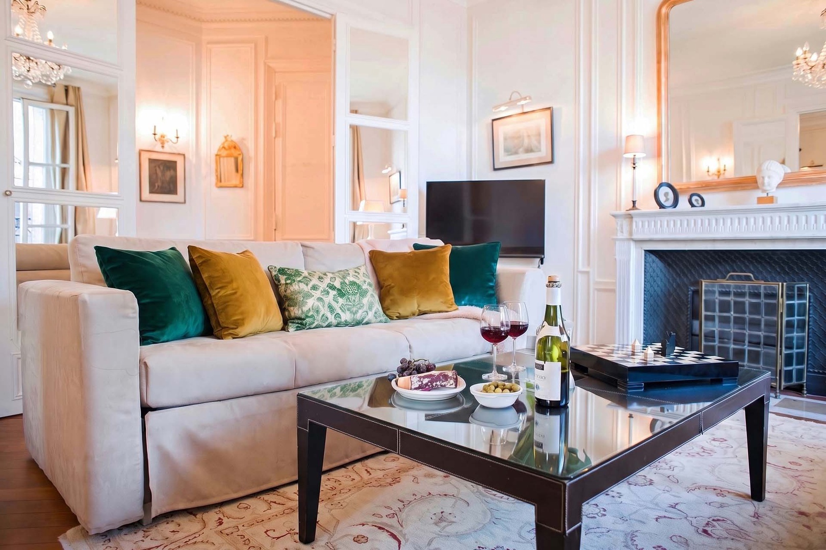 Mirrored French doors separate the living area from the hall.