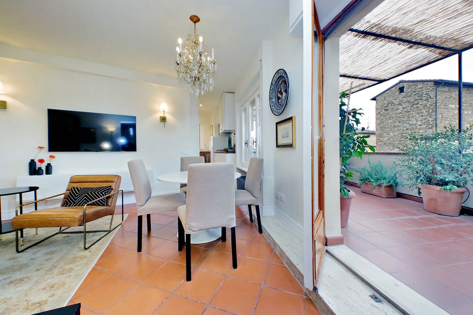 Large French doors open off the dining area to the expansive terrace.