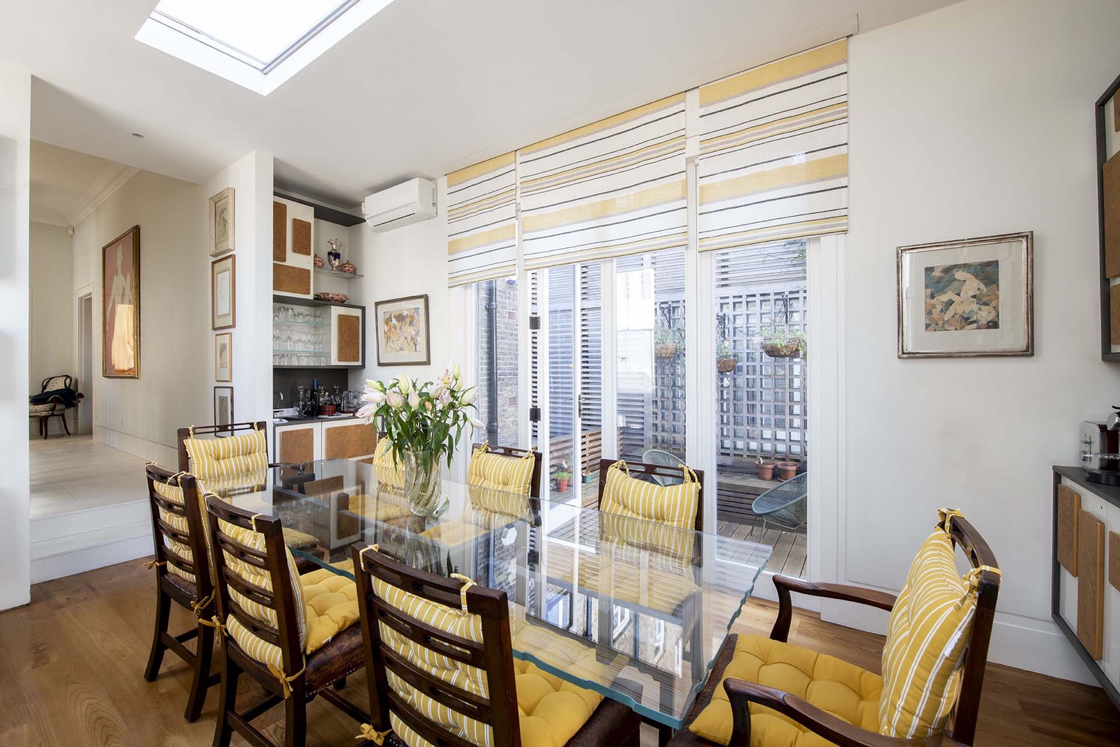 Light-filled dining room opens directly to patio.