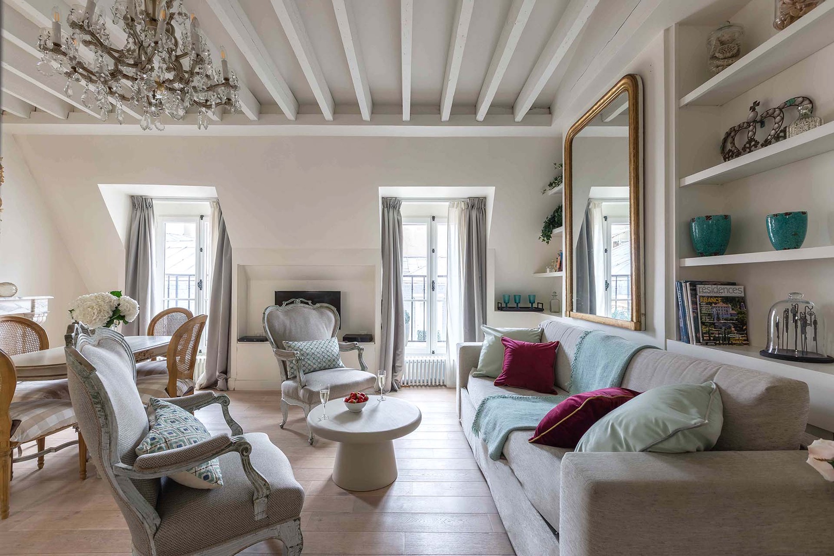Beautiful light fills the living room from large French windows.