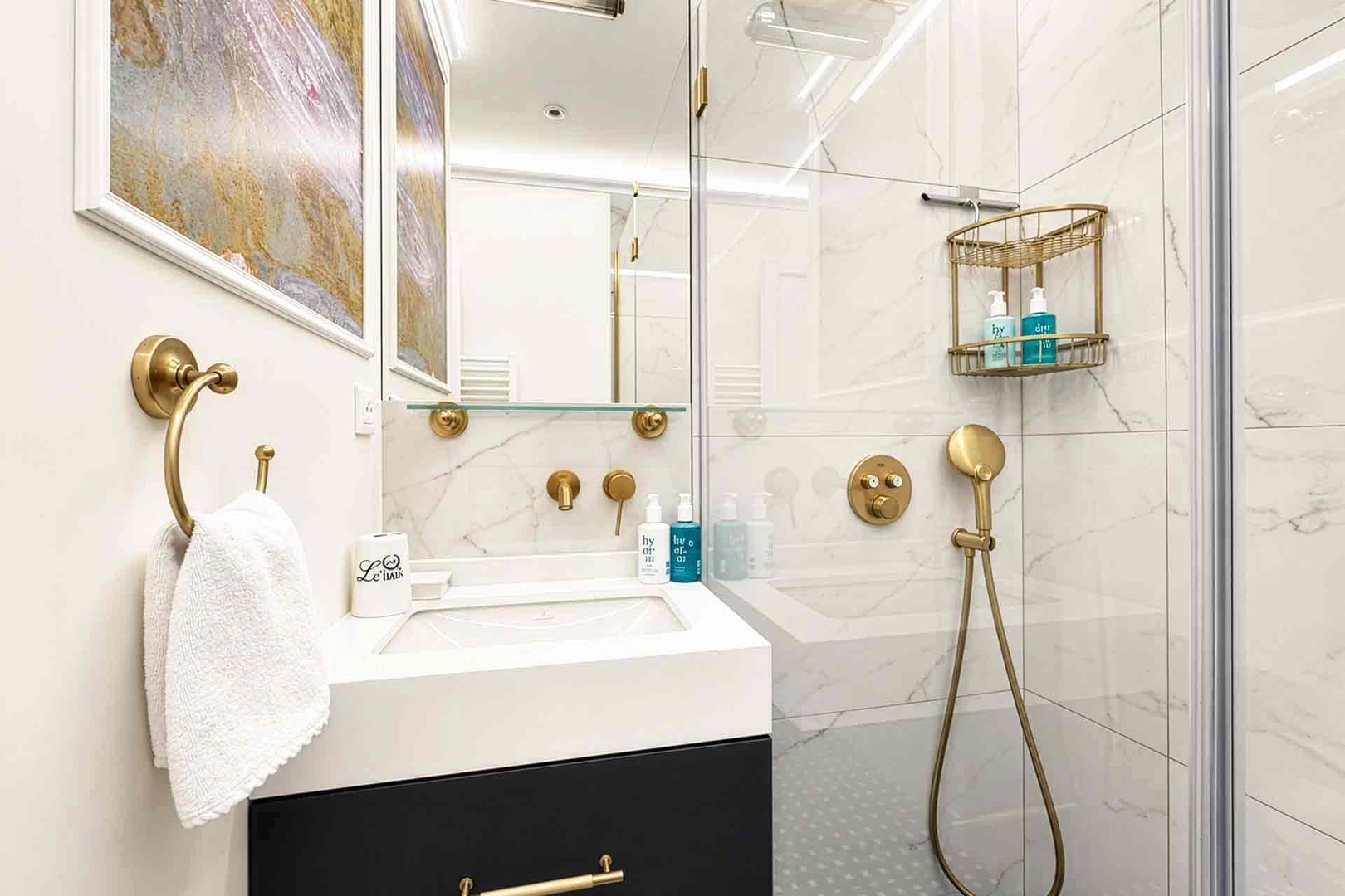 Bathroom 2 with shower and sink. Toilet in a separate half bath.