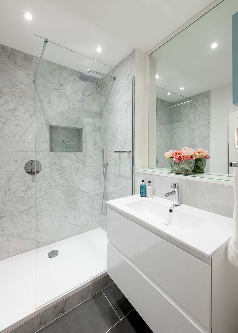 Bathroom with large shower and sink.