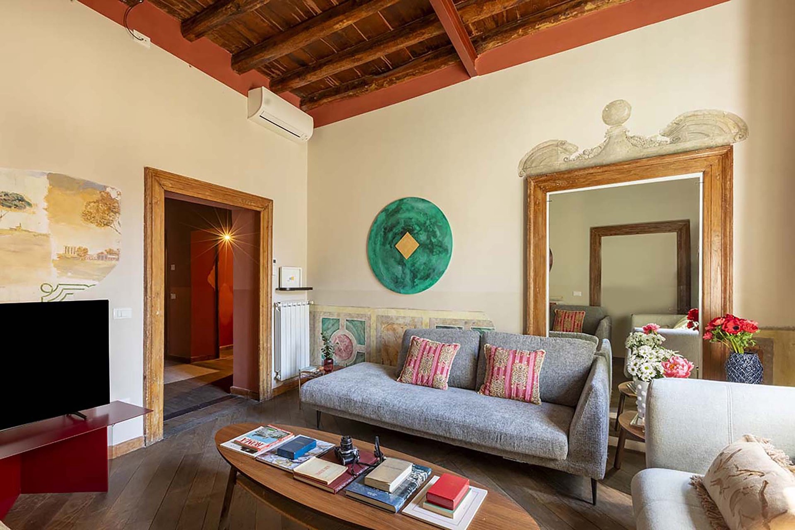 Wood beamed high ceilings add to the charm.