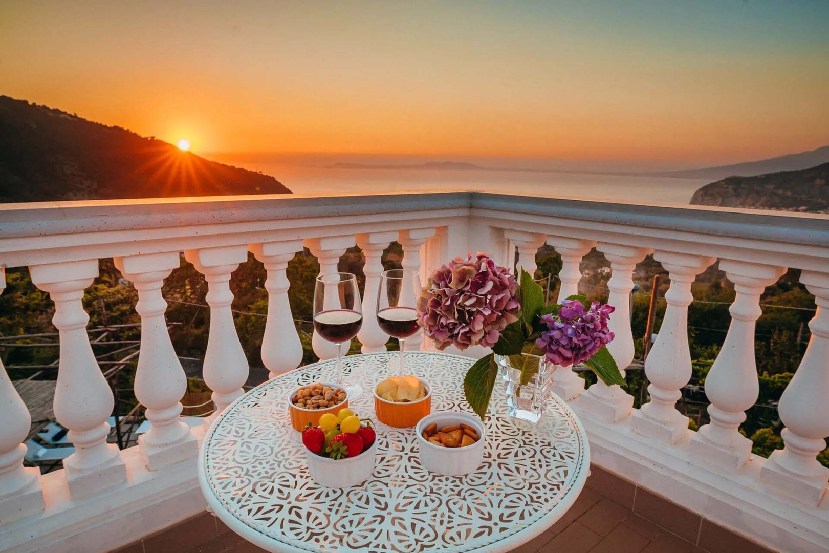Enjoy a sunset aperitivo from the upper level terrace.