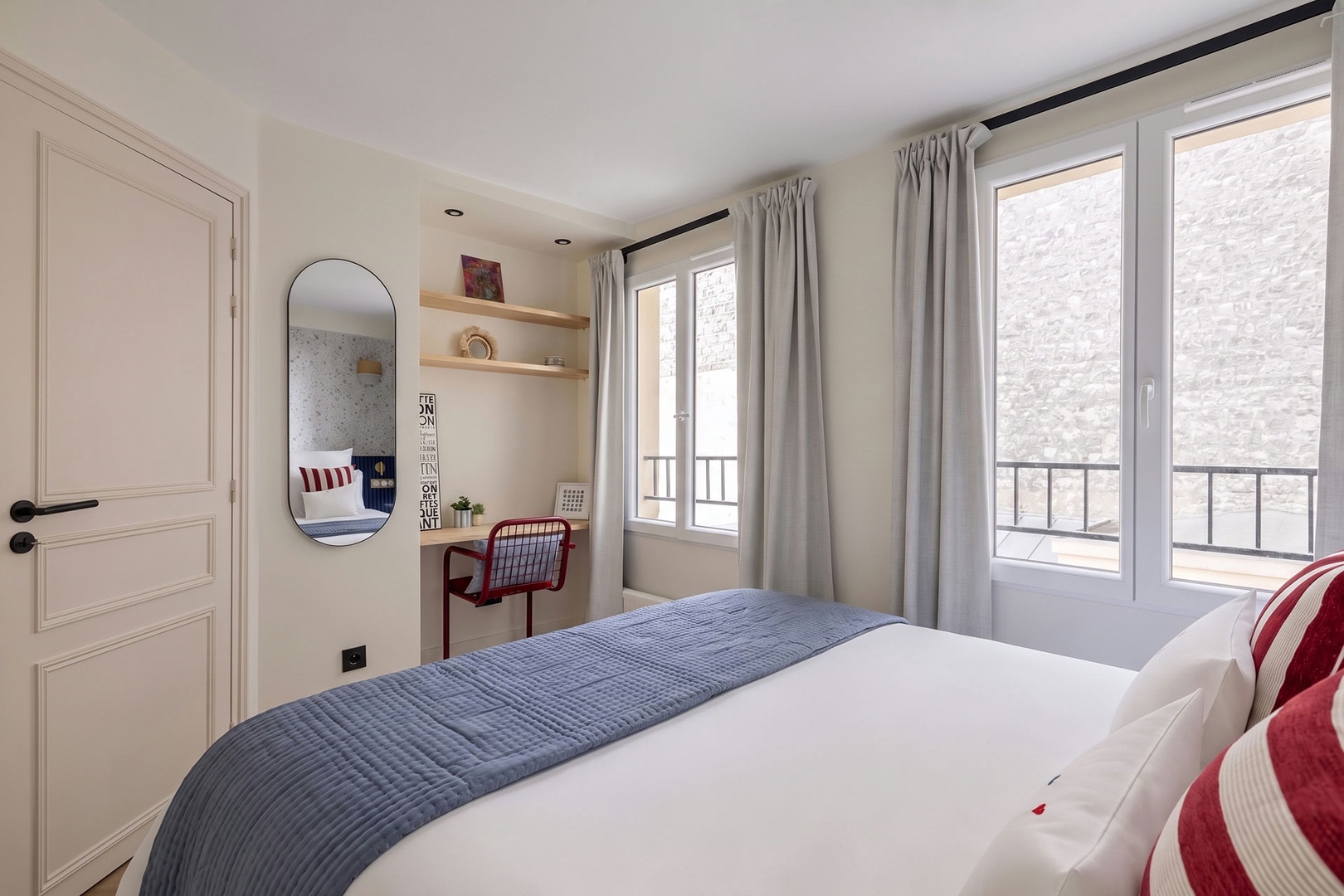 Bedroom has a charming built-in desk nook.