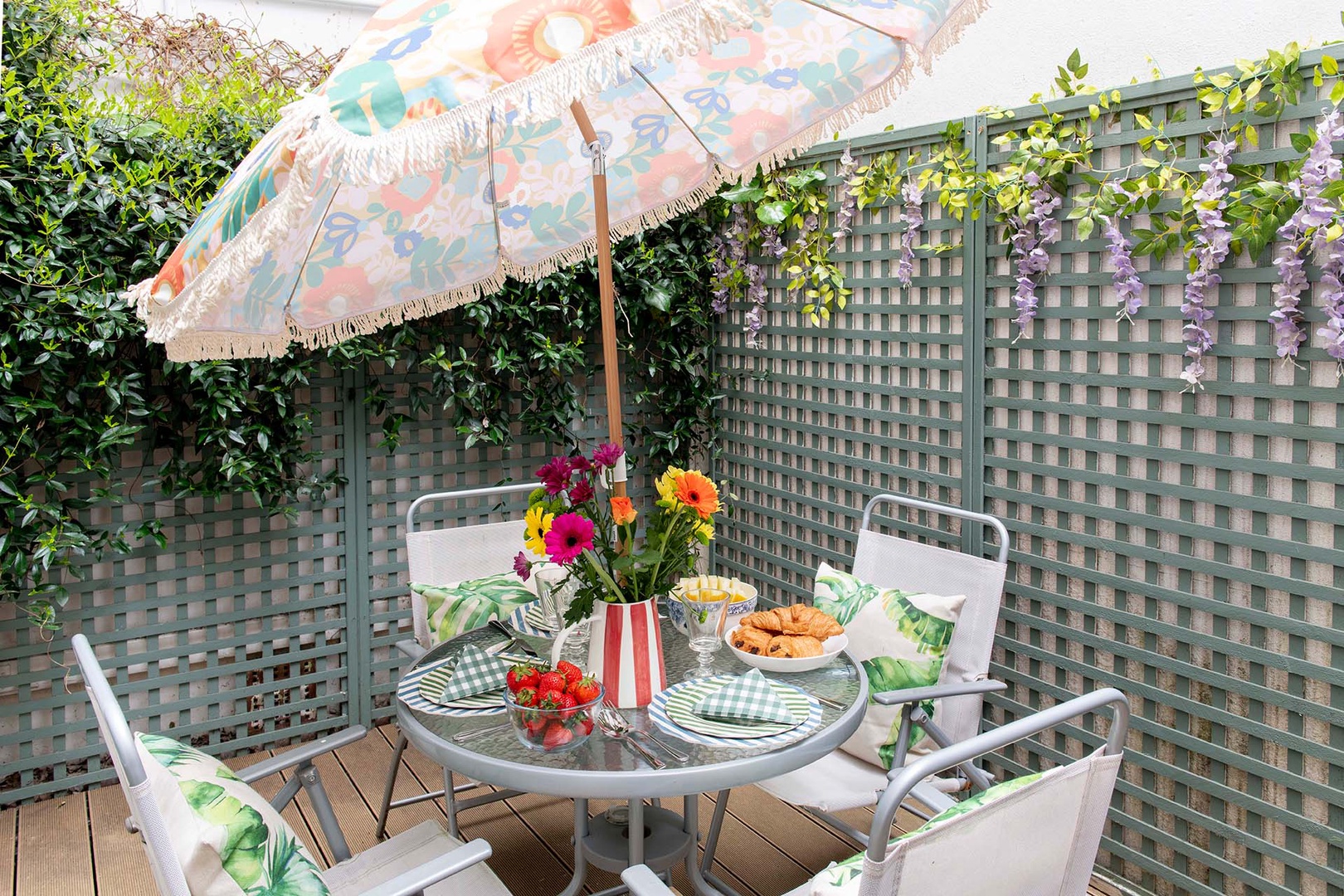 Relax outdoors on the patio with table for dining al fresco.