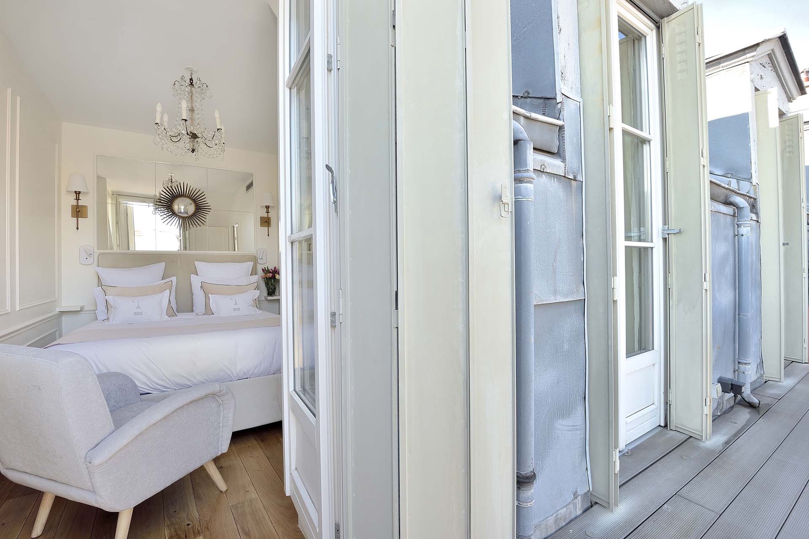 French doors from the bedroom open to the balcony.