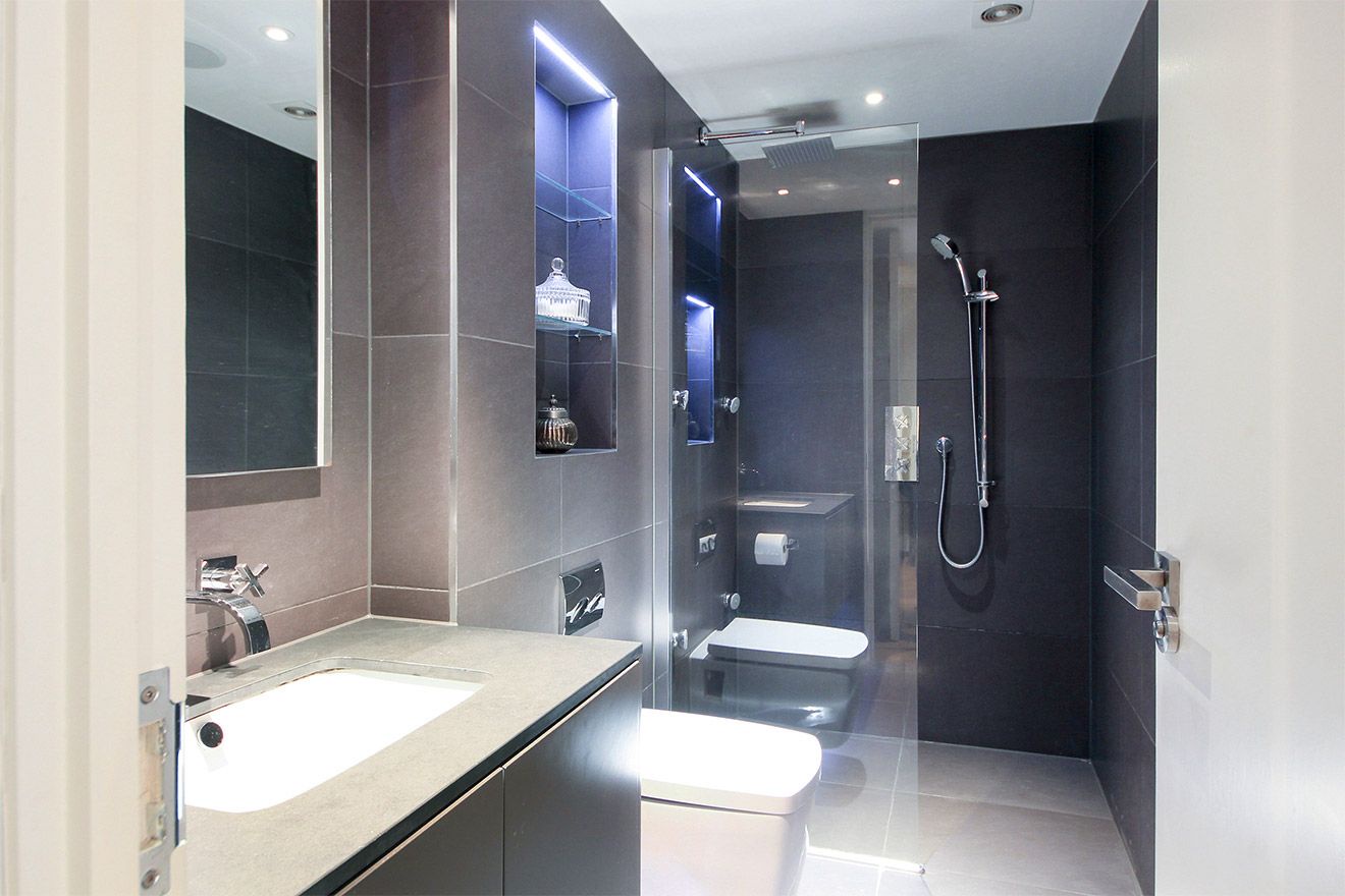 En suite bathroom with large walk-in shower, sink and toilet