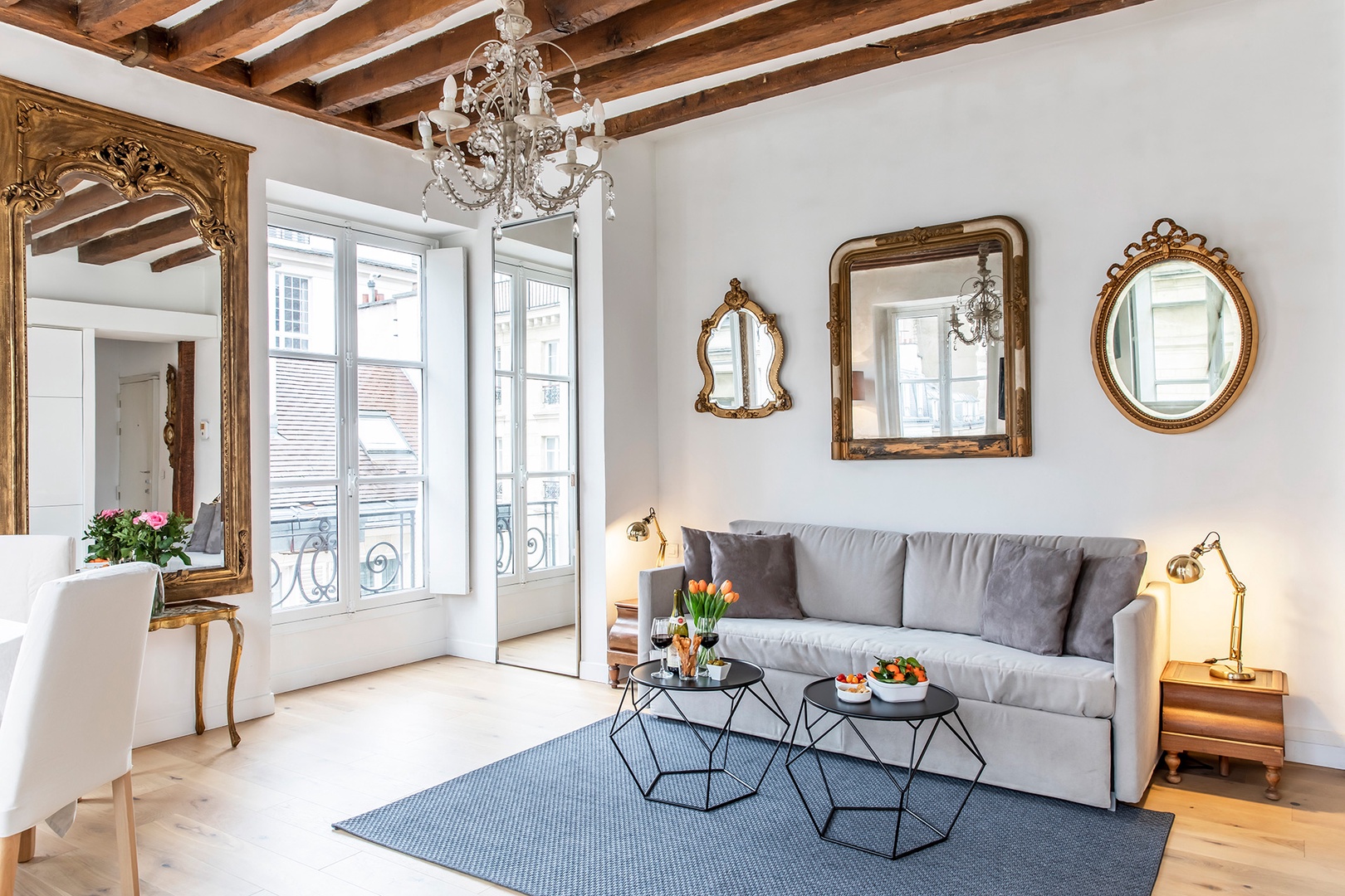 A stunning living room with high ceilings and natural light!