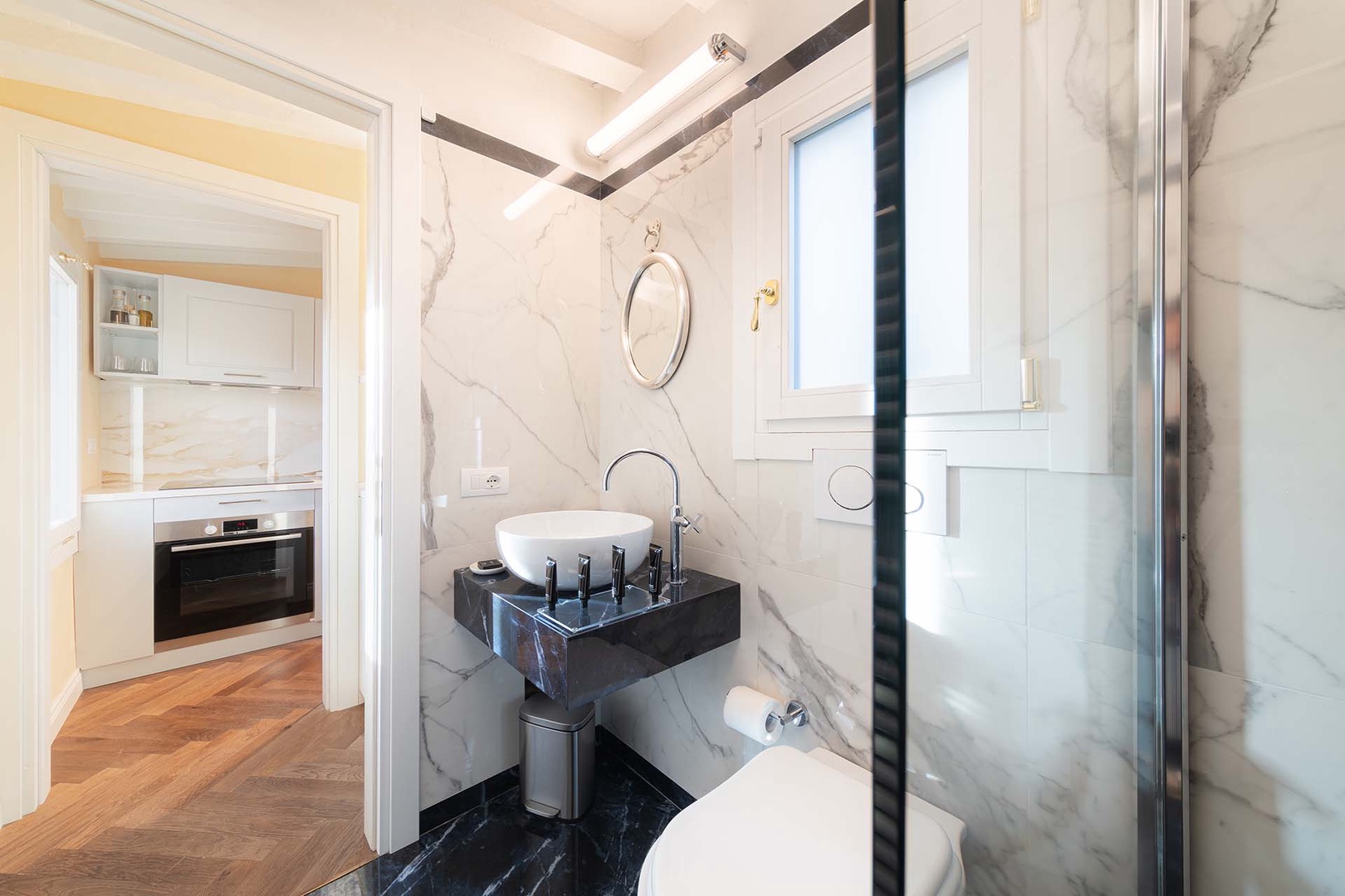 Beautiful bathroom located off the kitchen on main level.