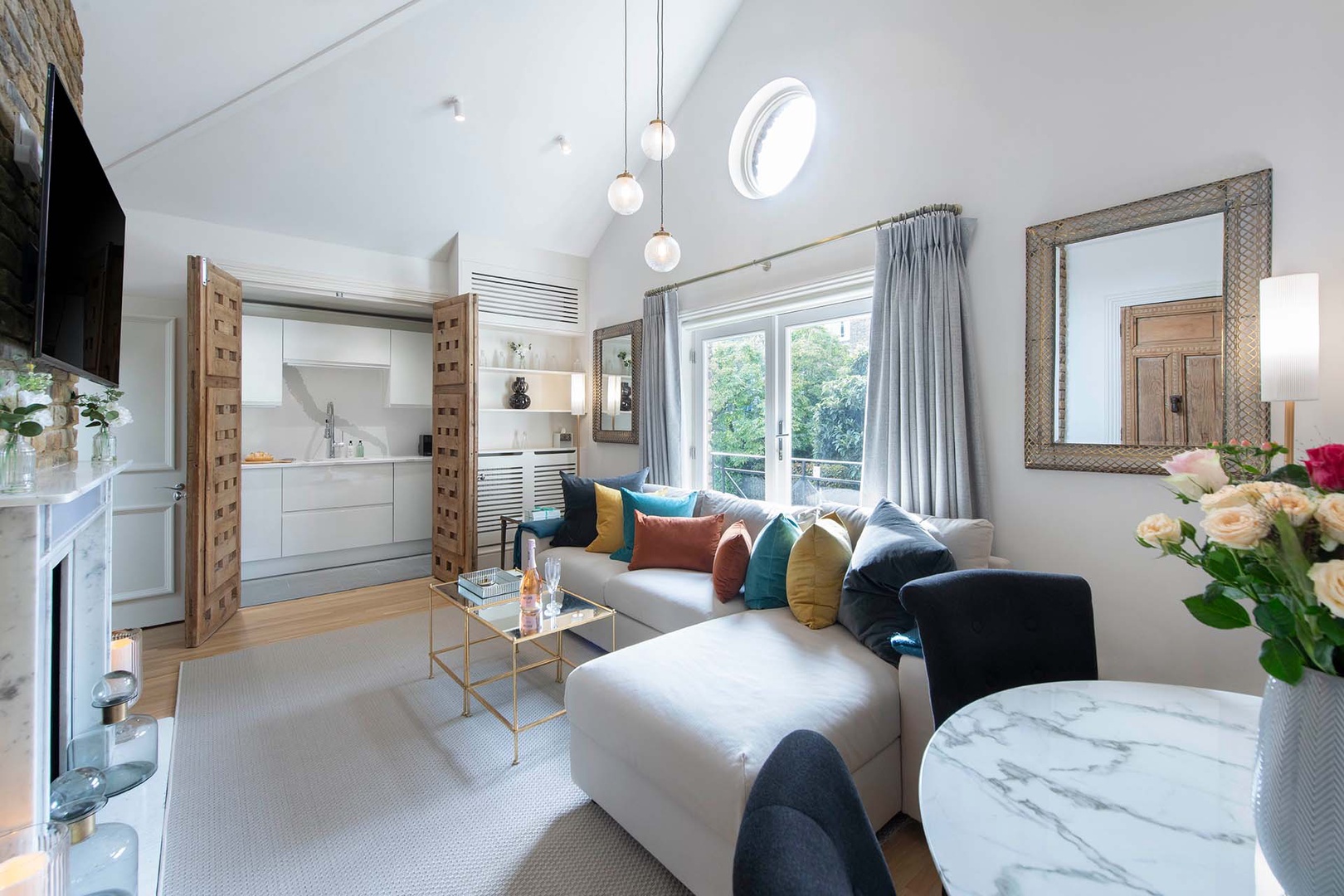 High ceilings and large windows fill the living area with light.