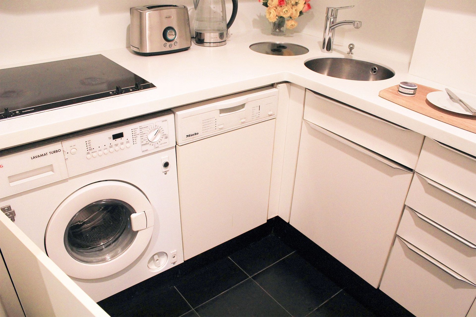 Combo washer and dyer located in kitchen