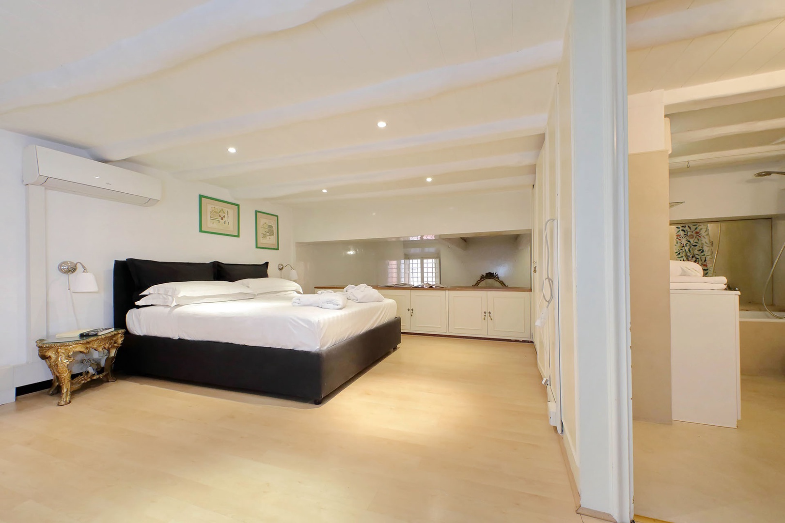 Bathroom is located next to the bedroom.