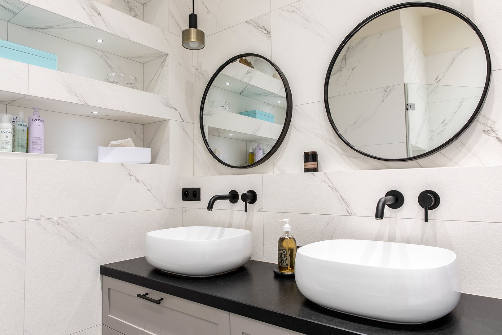 Double sinks with plenty of storage below in en suite bathroom 1.