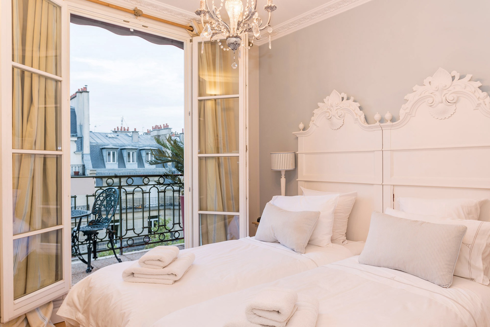 Bedroom 2 has a small balcony and lovely French windows.