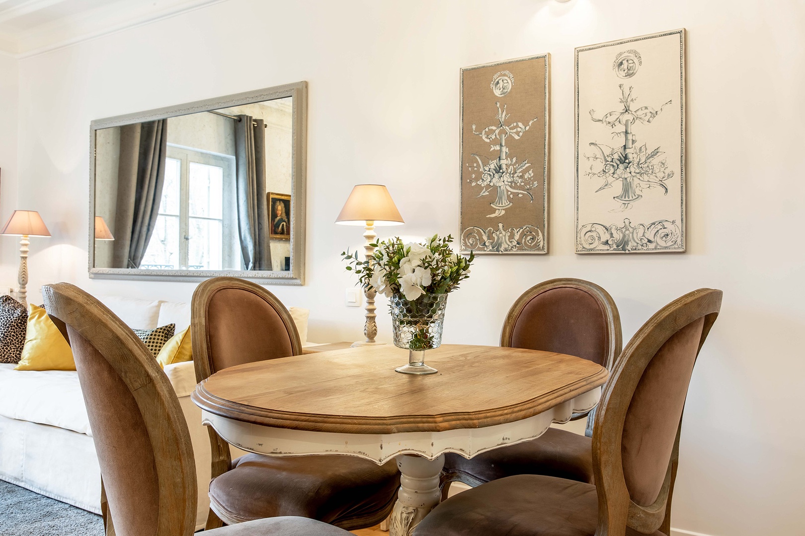 The French oak dining table comfortably seats four.