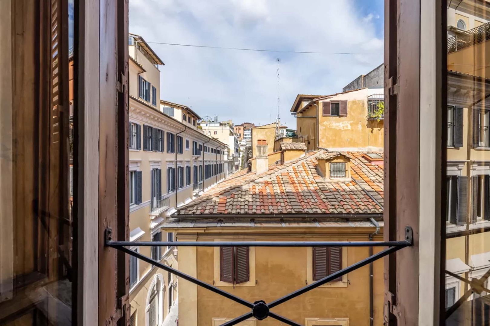 View of rooftops from the balconette in bedroom 3.