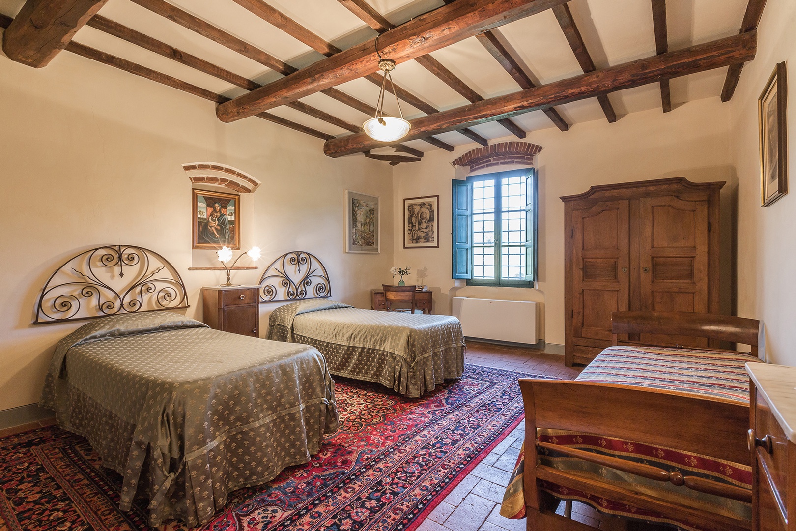 Bedroom 5 has three beds. The wardrobe, bedside table and bureau date from the 1700s.