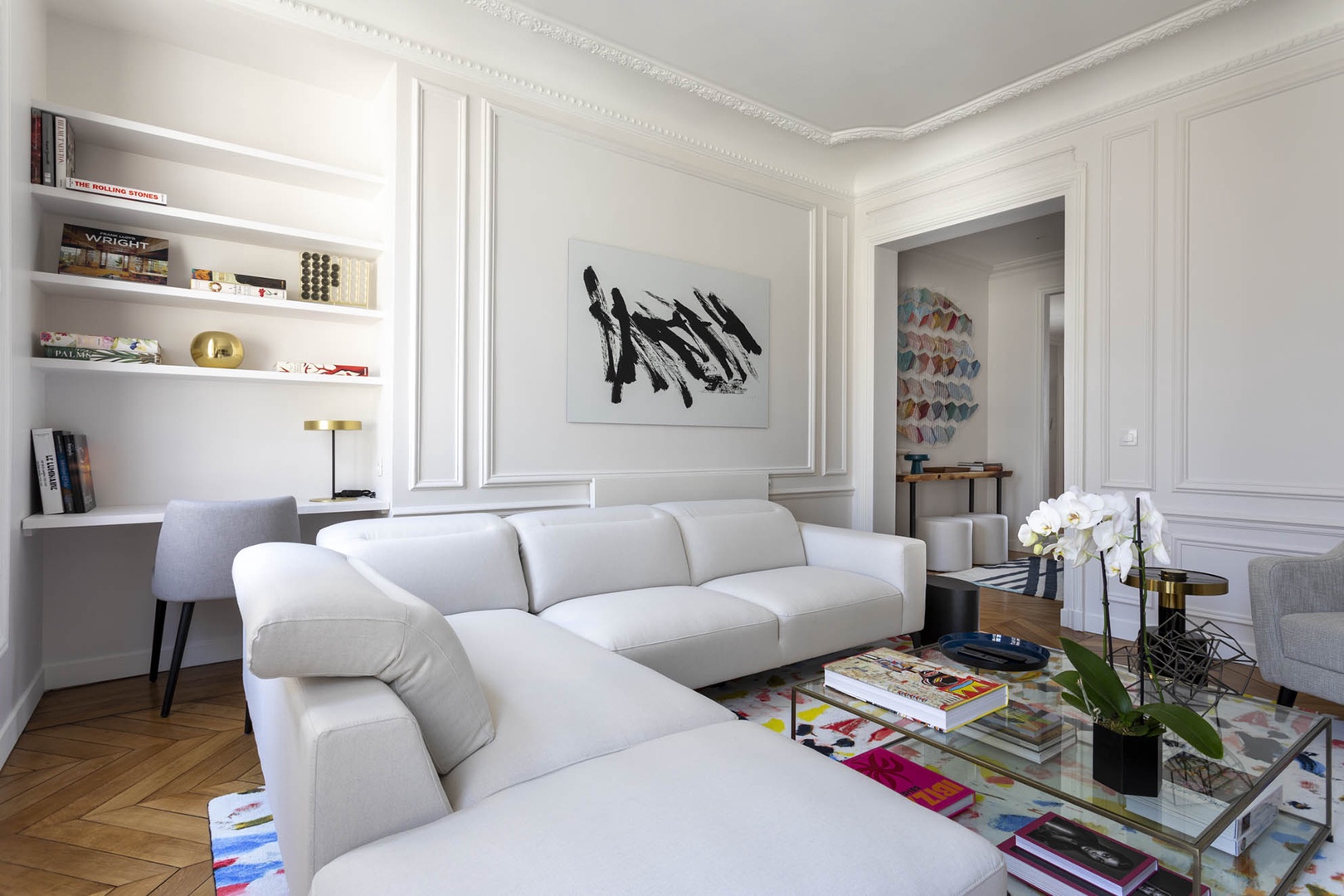 Contemporary art decorates the walls of the living room.