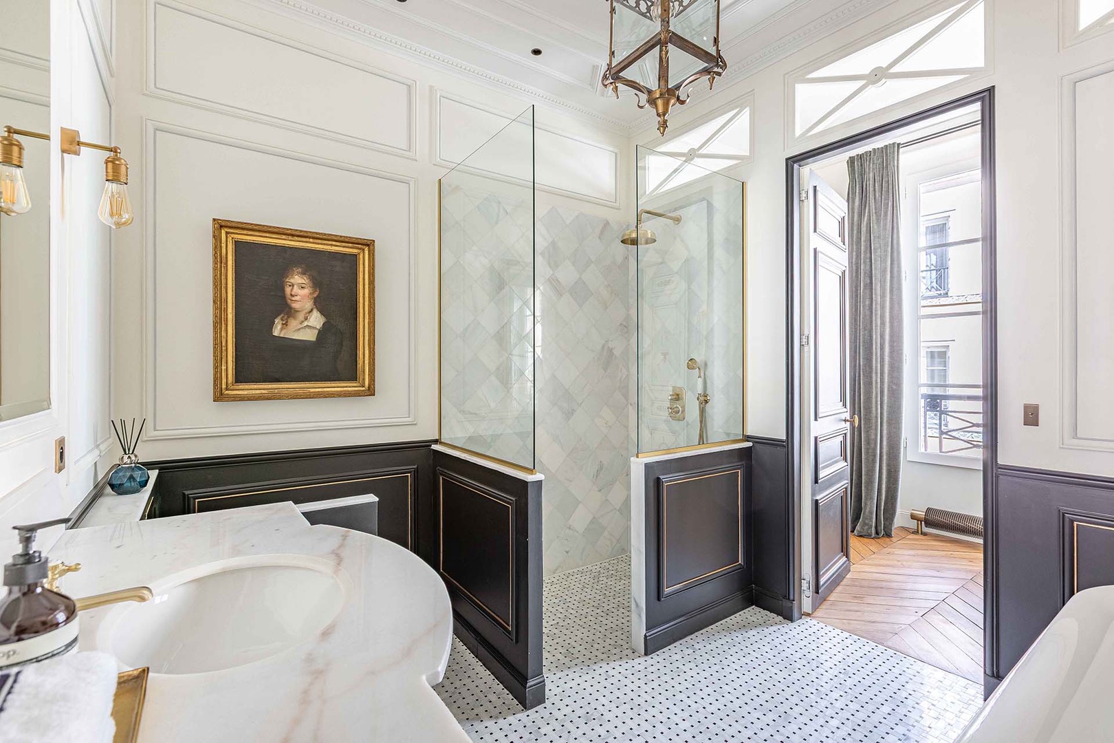 Luxurious stand alone bathtub and large shower.