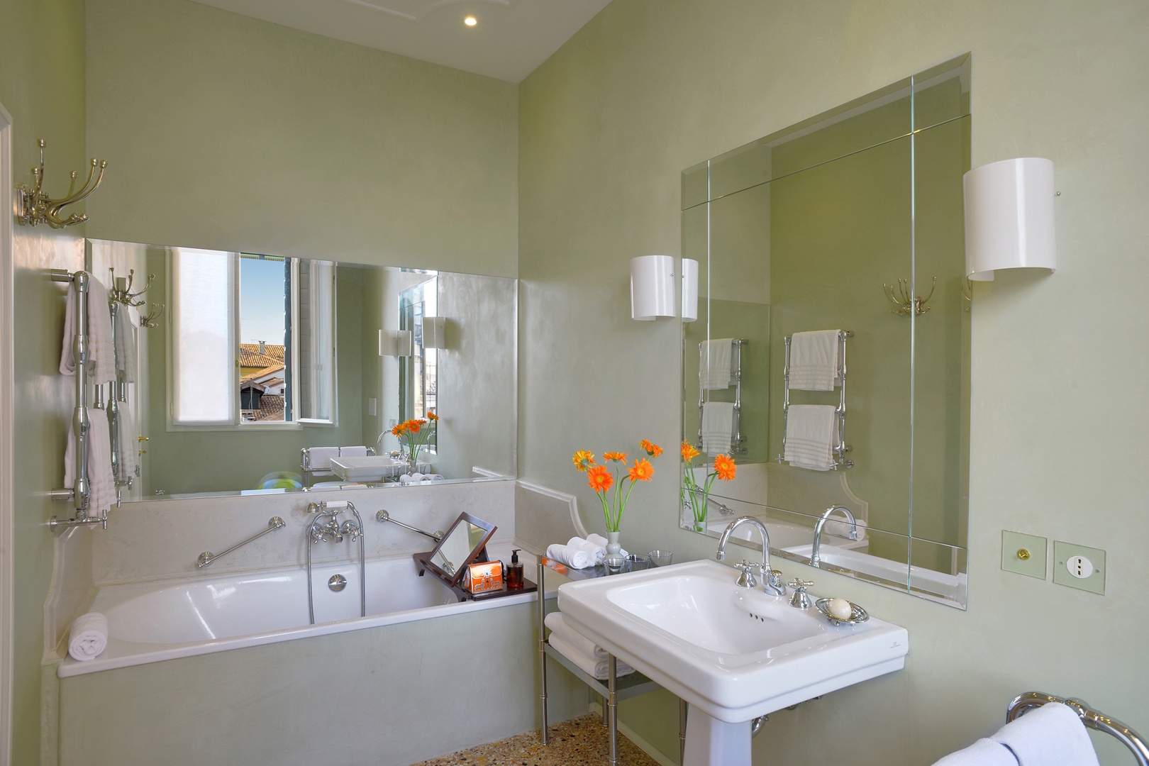 En suite bathroom for bedroom 1 with bathtub and handheld showerhead.