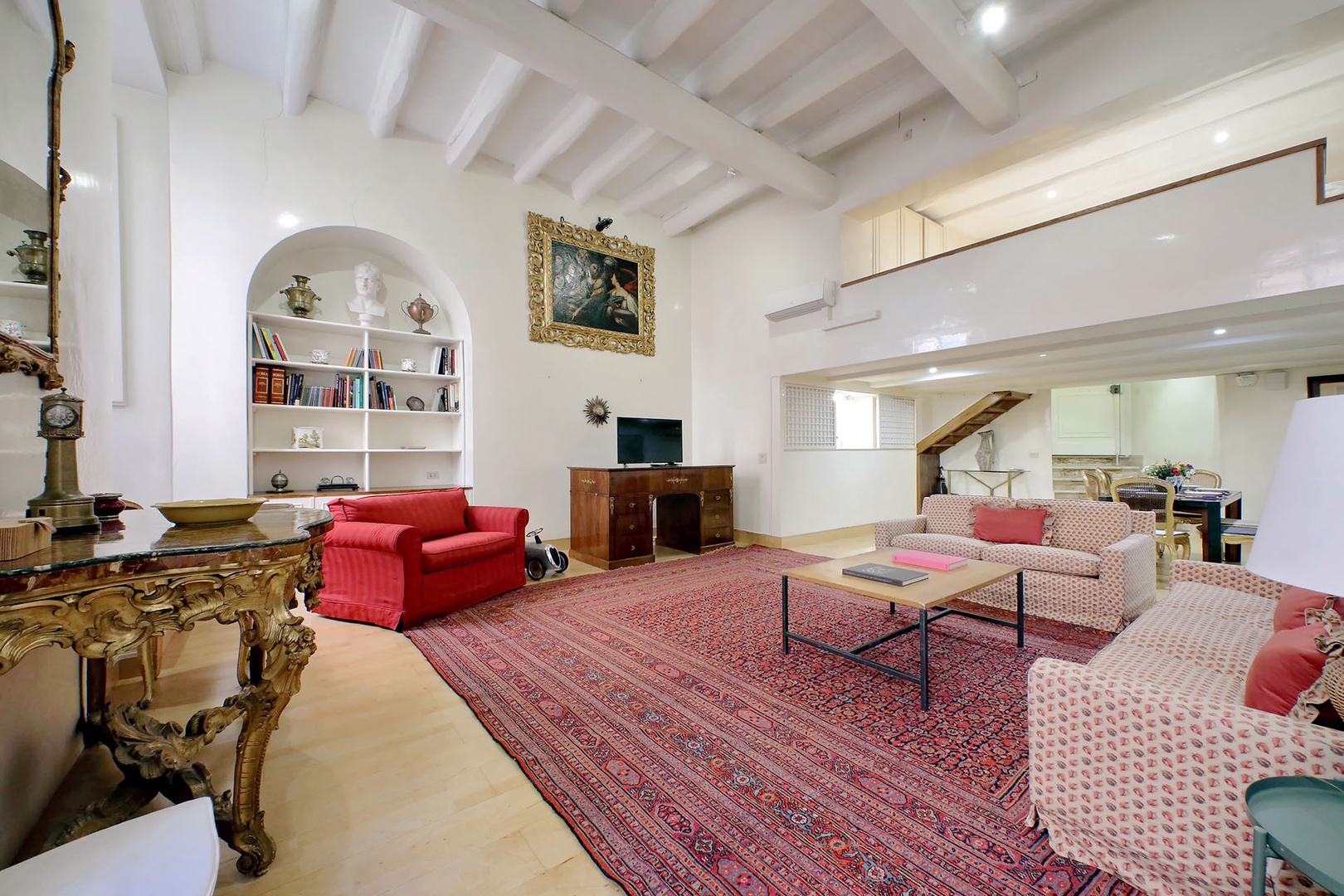 Loft area has the bedroom and bathroom.