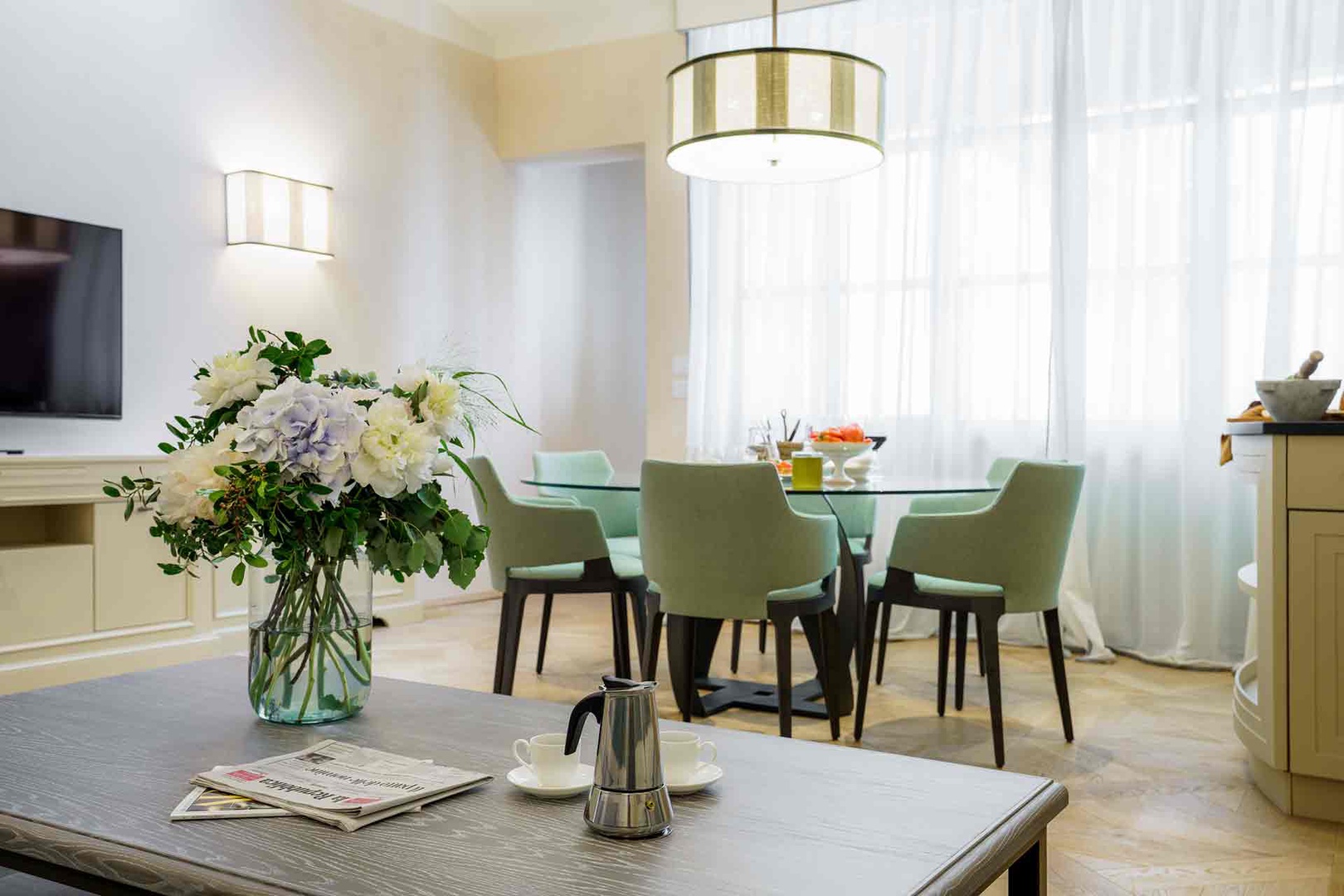 Settle in at your private dining table with morning coffee, surrounded by soft natural light.