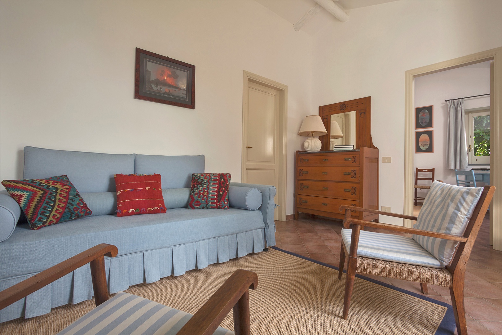 Cottage living room has a foldaway bed for 1 person.