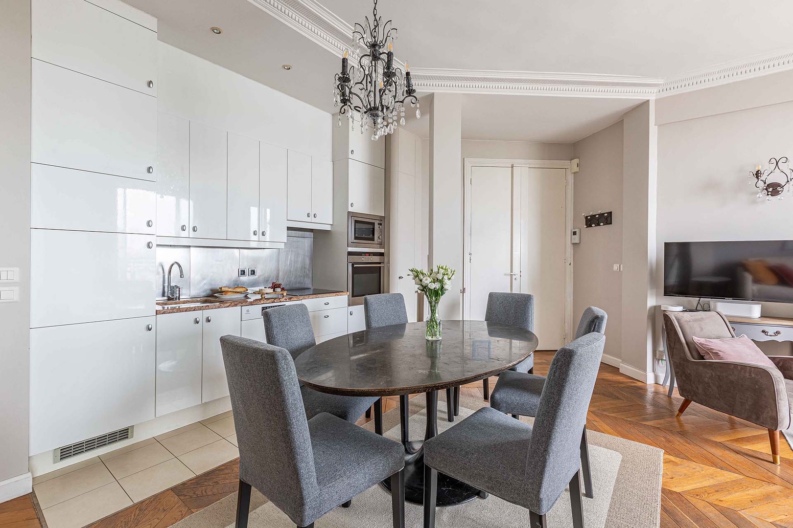 The modern and stylish kitchen is fully equipped with everything you need.