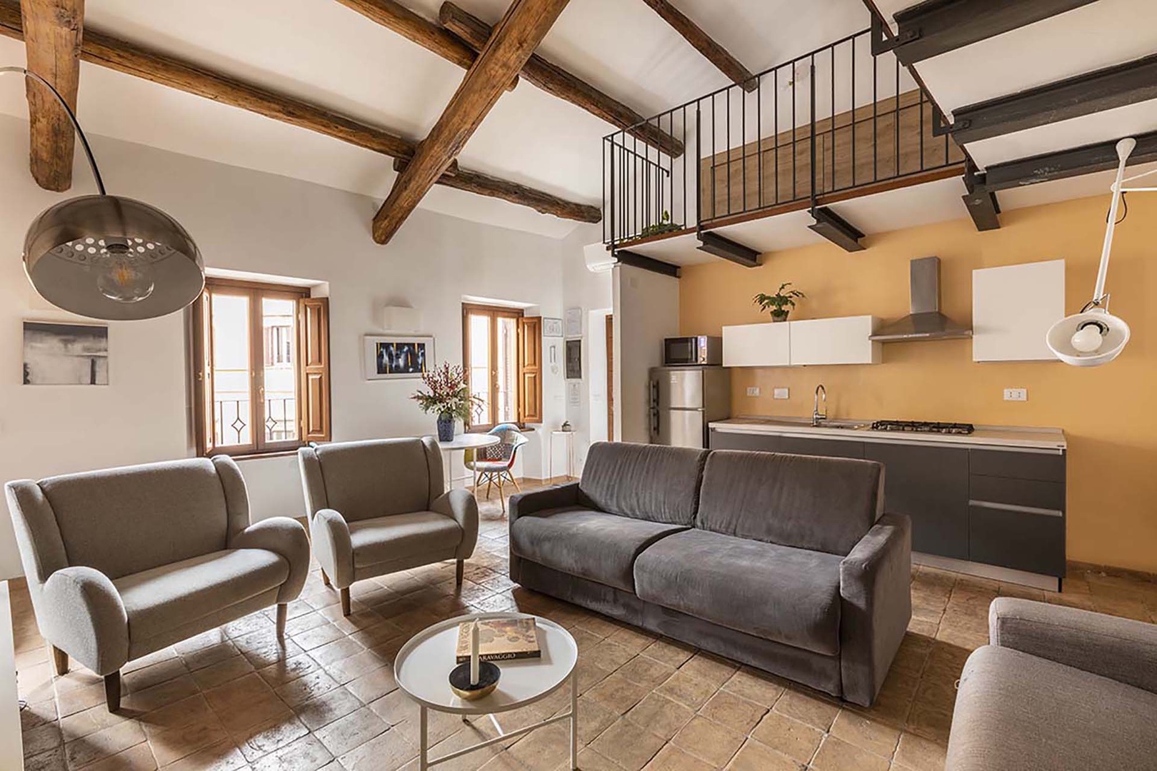 Open concept dining area, living room and mini kitchen on the second floor.