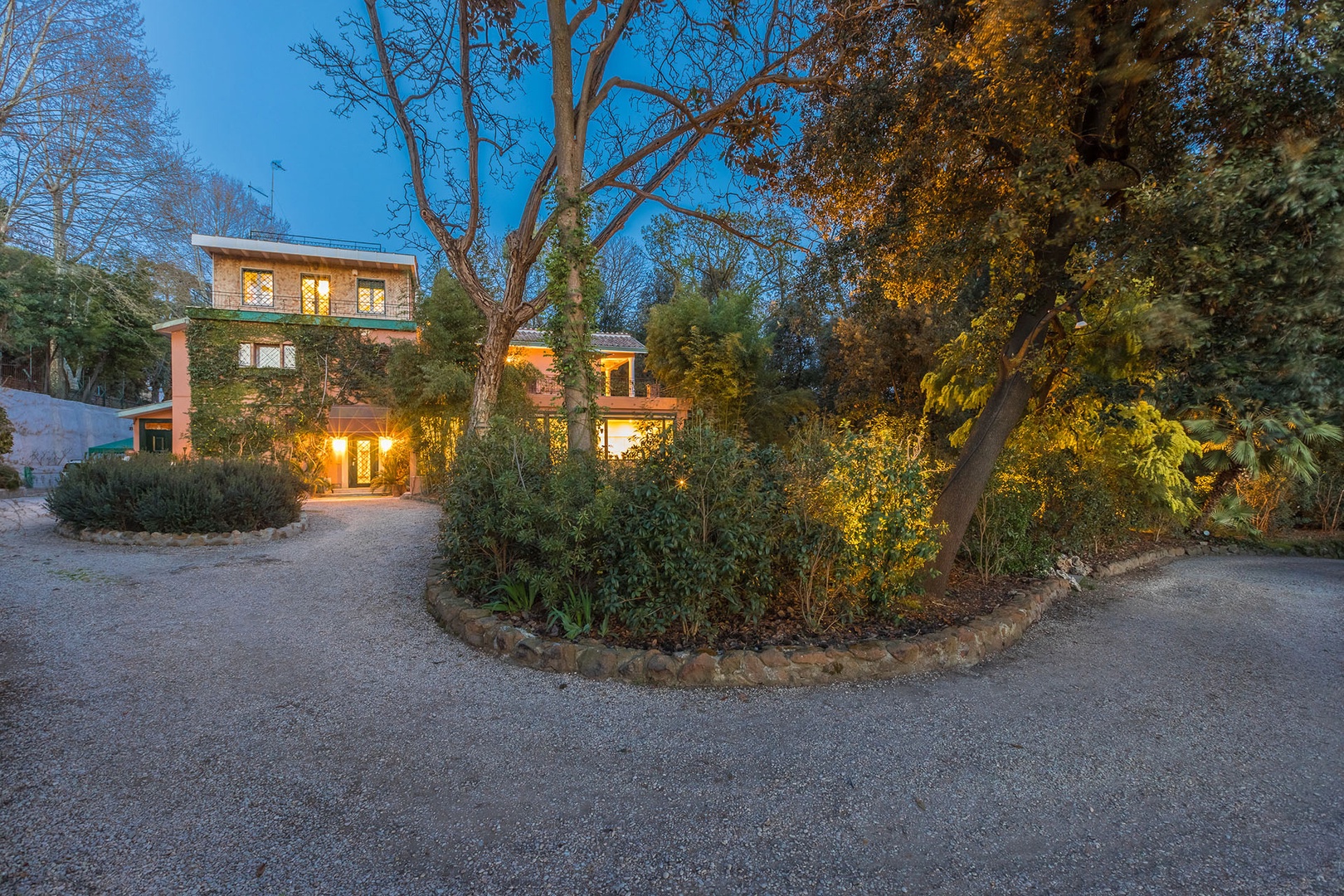 Sweeping gravel driveway leads up to Villa Aurora.