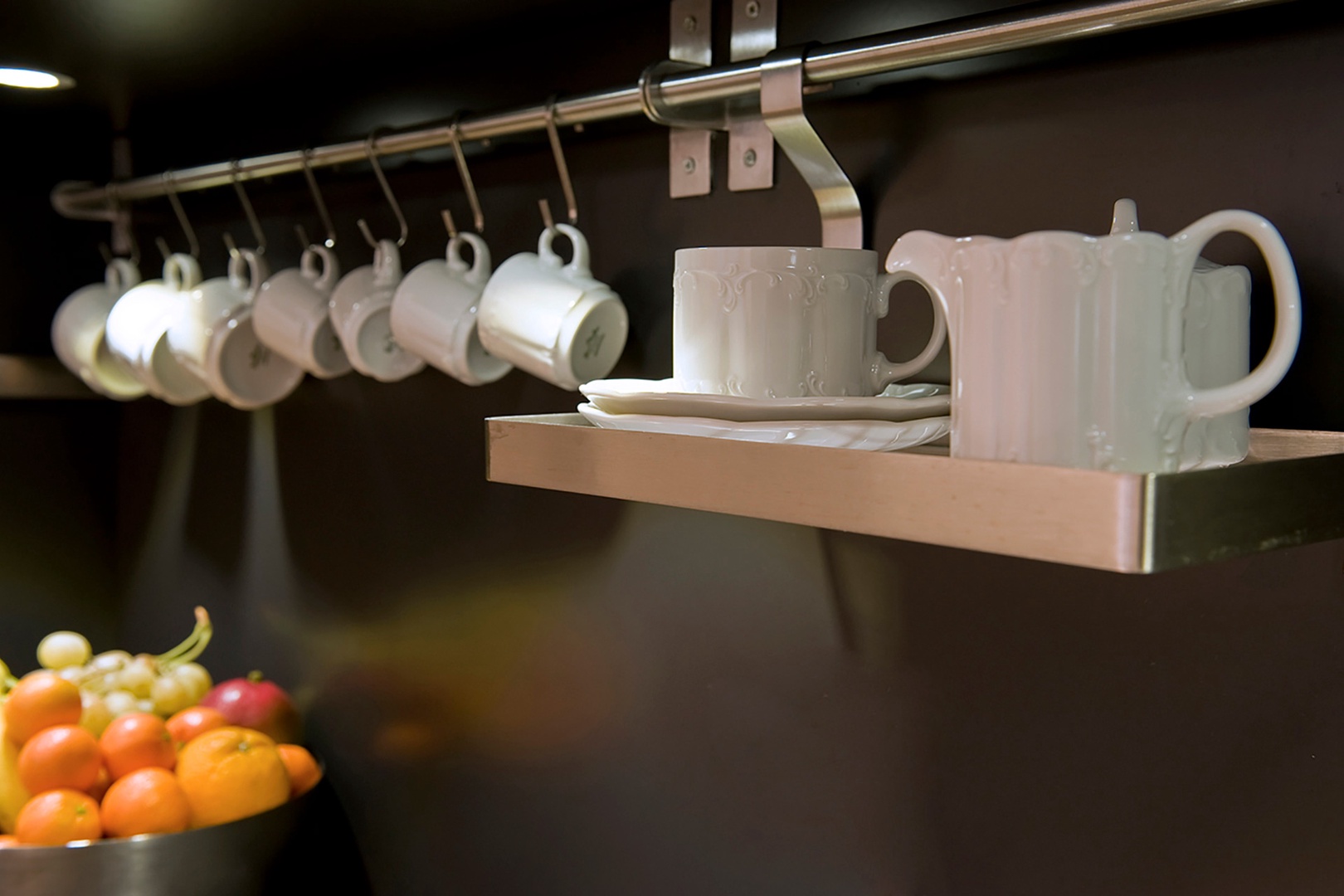 Kitchen has a Nespresso machine stocked with coffee capsules.