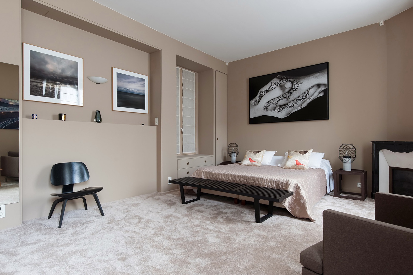 The bedroom exudes luxury and artistic flair.