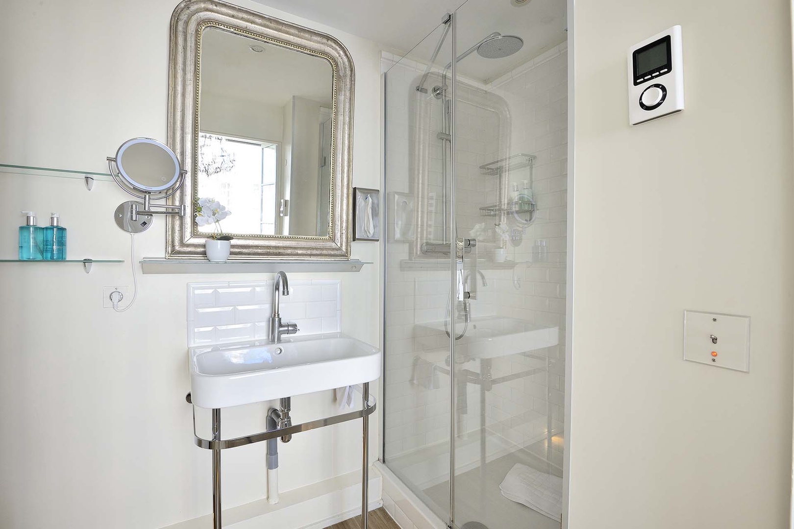 The large shower has a rainfall shower head.