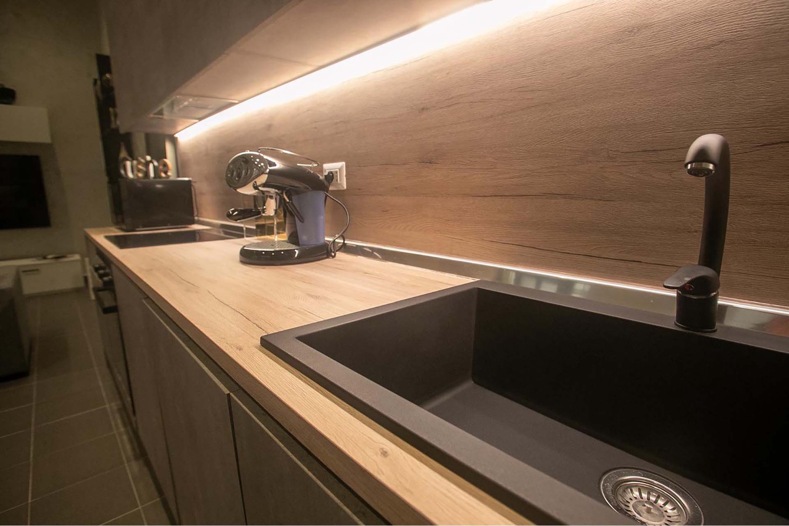 Sleek kitchen with excellent lighting.