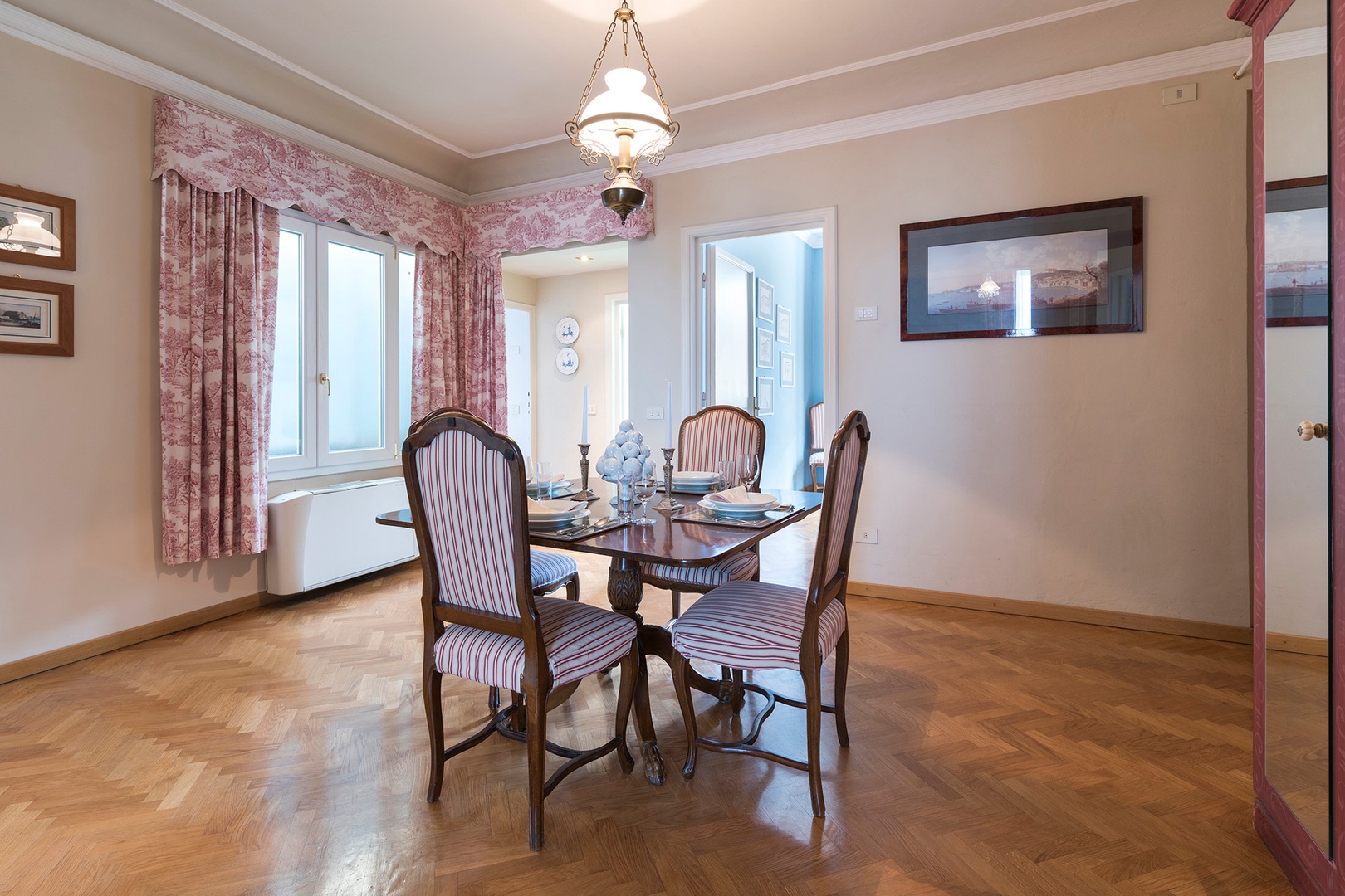 Dining room is at the center of the apartment, with easy access to the living room and kitchen.