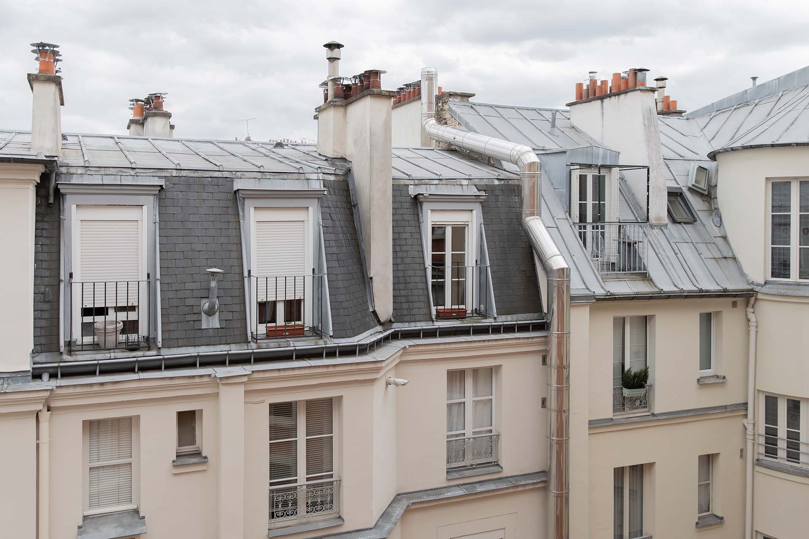 Charming courtyard views with Parisian mansard roofs.