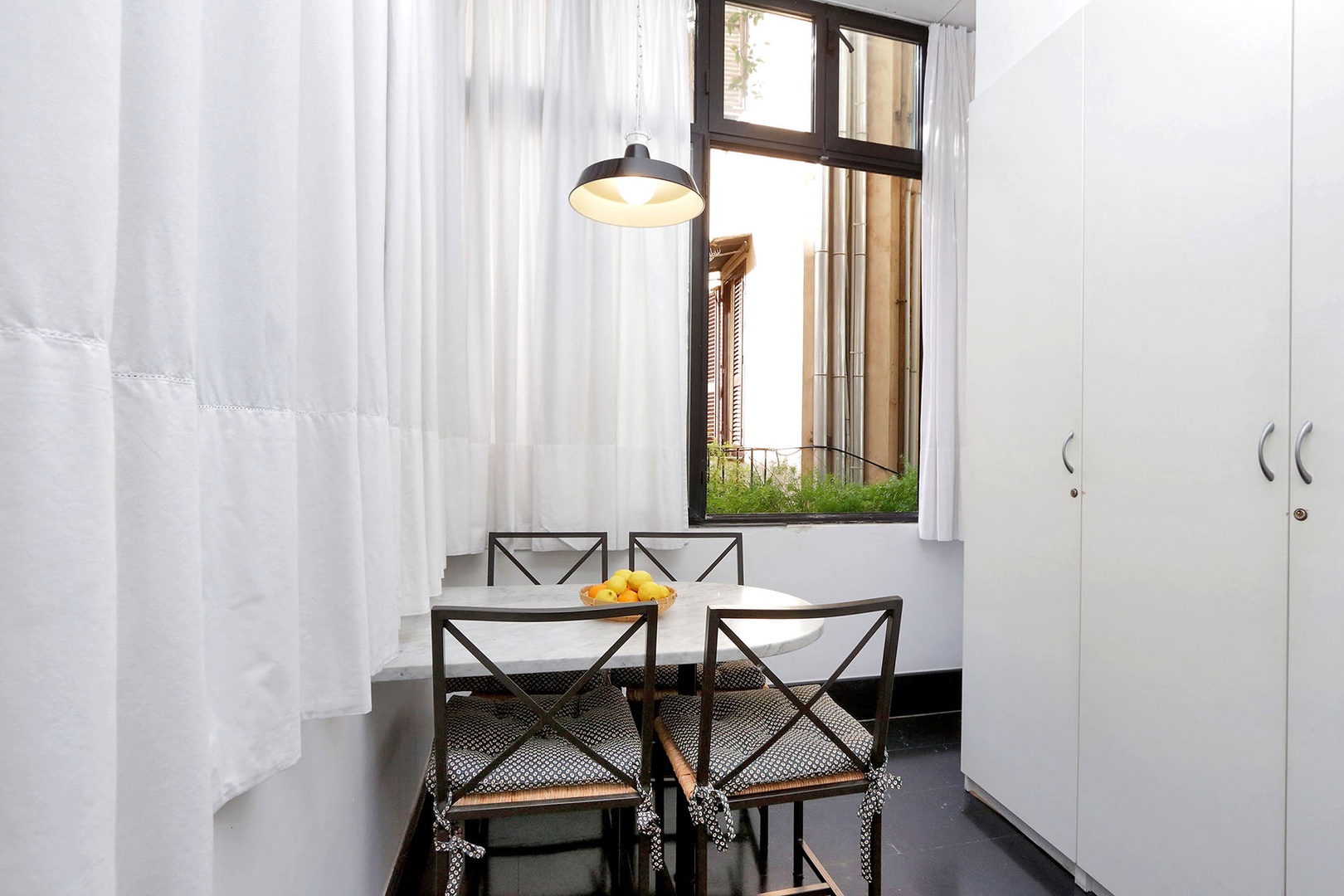 Cheerful breakfast nook has a table and chairs for 4.