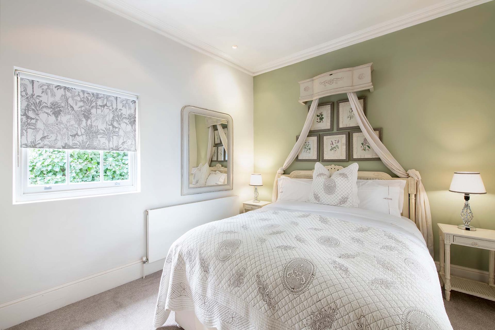 Lovely bed in bedroom 1 of London mews.