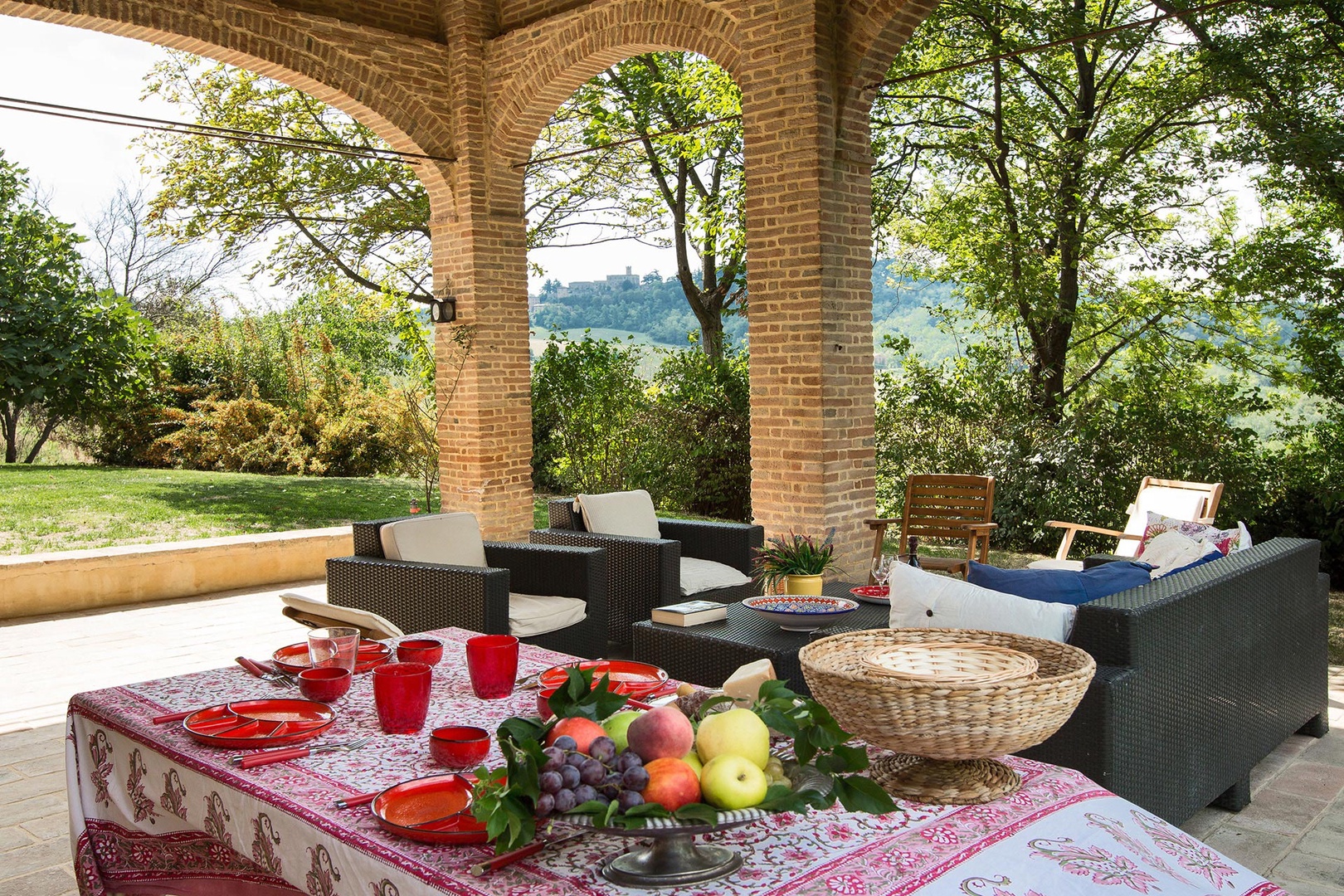 The delightful covered terrace offers a view all the way to the nearby castle.