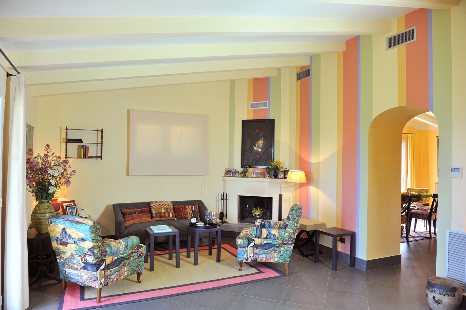 The second seating area in the living room by the fireplace.