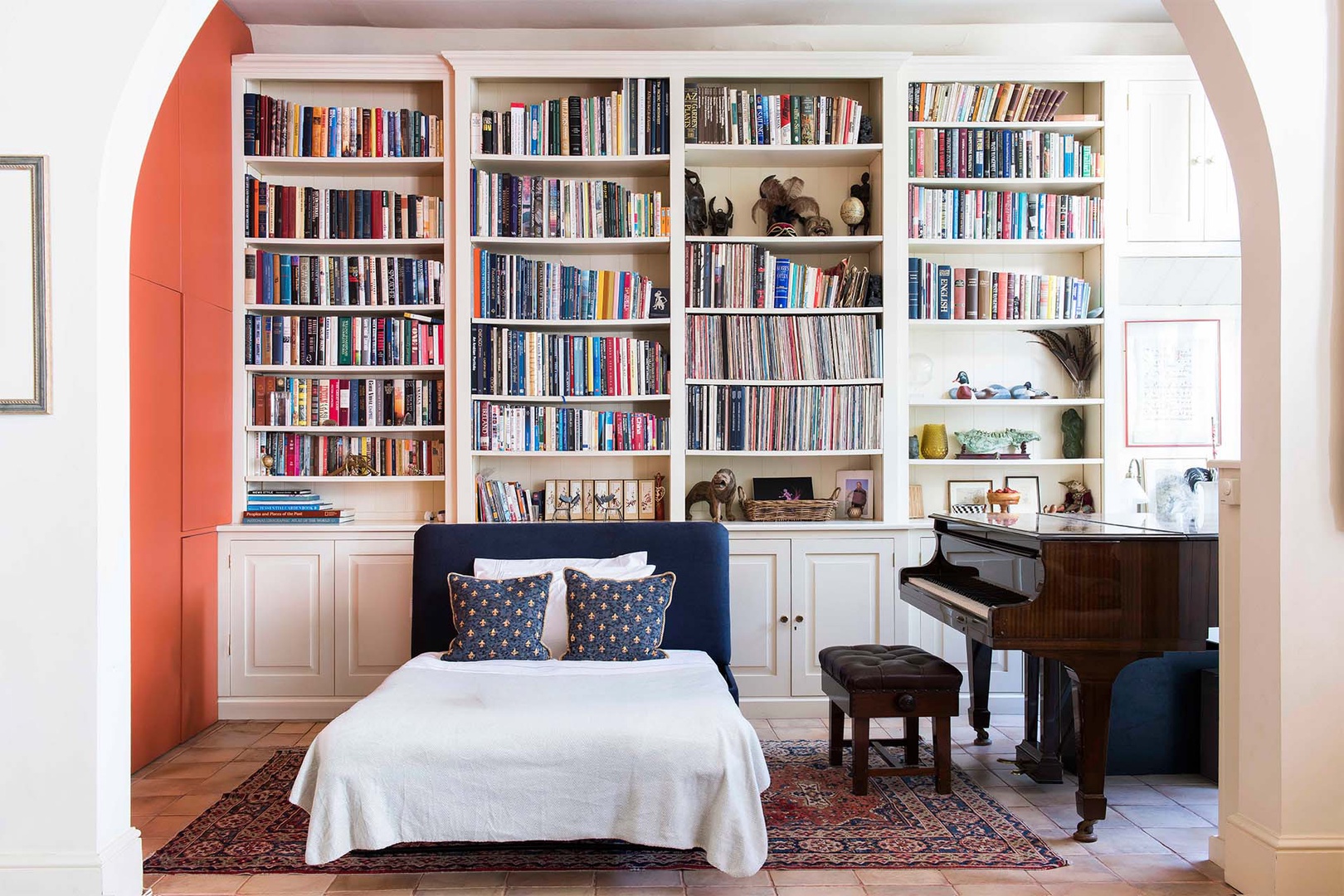 Ottoman in living room creates an additional sleeping space.
